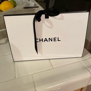 CHANEL Classic White Bag with Black Accents